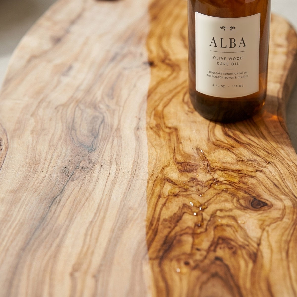 Dry olive wood next to freshly oiled olive wood grain