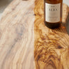 Dry olive wood next to freshly oiled olive wood grain