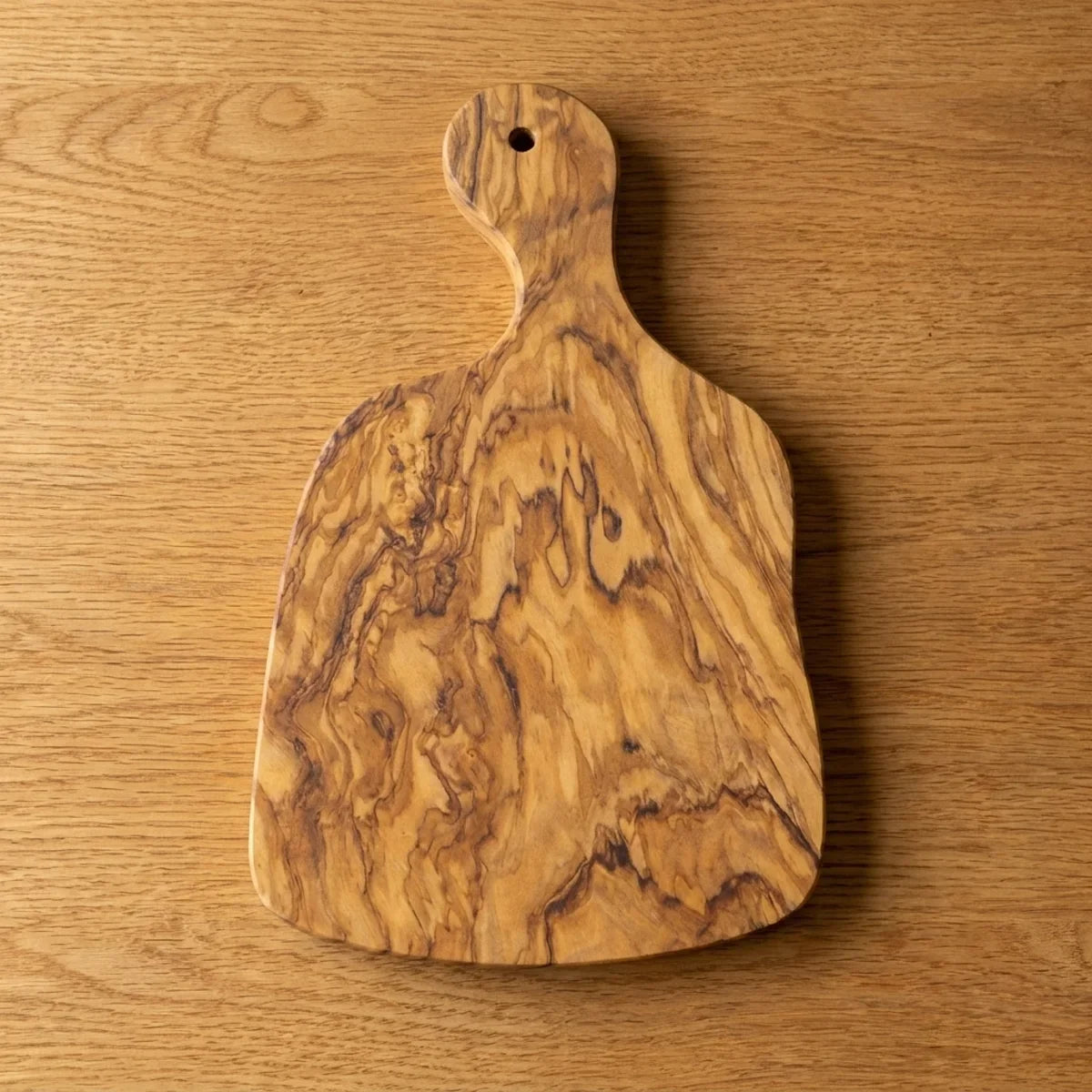 The Alba Olive Wood Paddle Board seen from above, the full grain readable