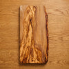 The Alba Live-Edge Olive Wood Slab seen from above, the full grain readable
