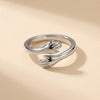 The Hug Ring seen from above, the two hands of the band readable