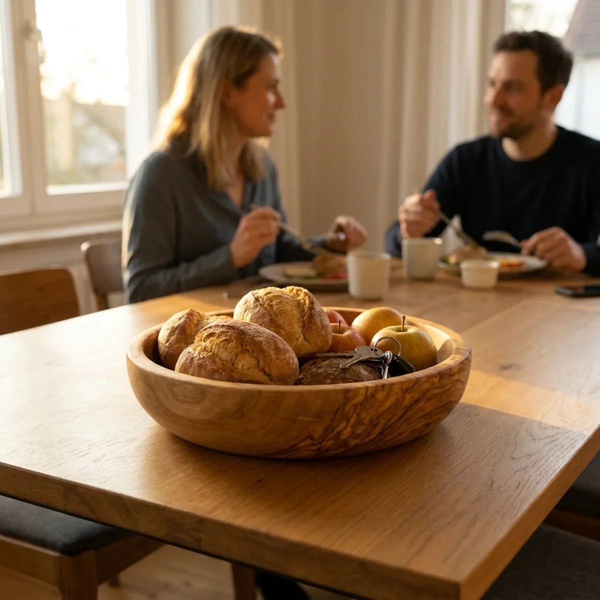 The Alba Olive Wood Bread Bowl in use on a dining table