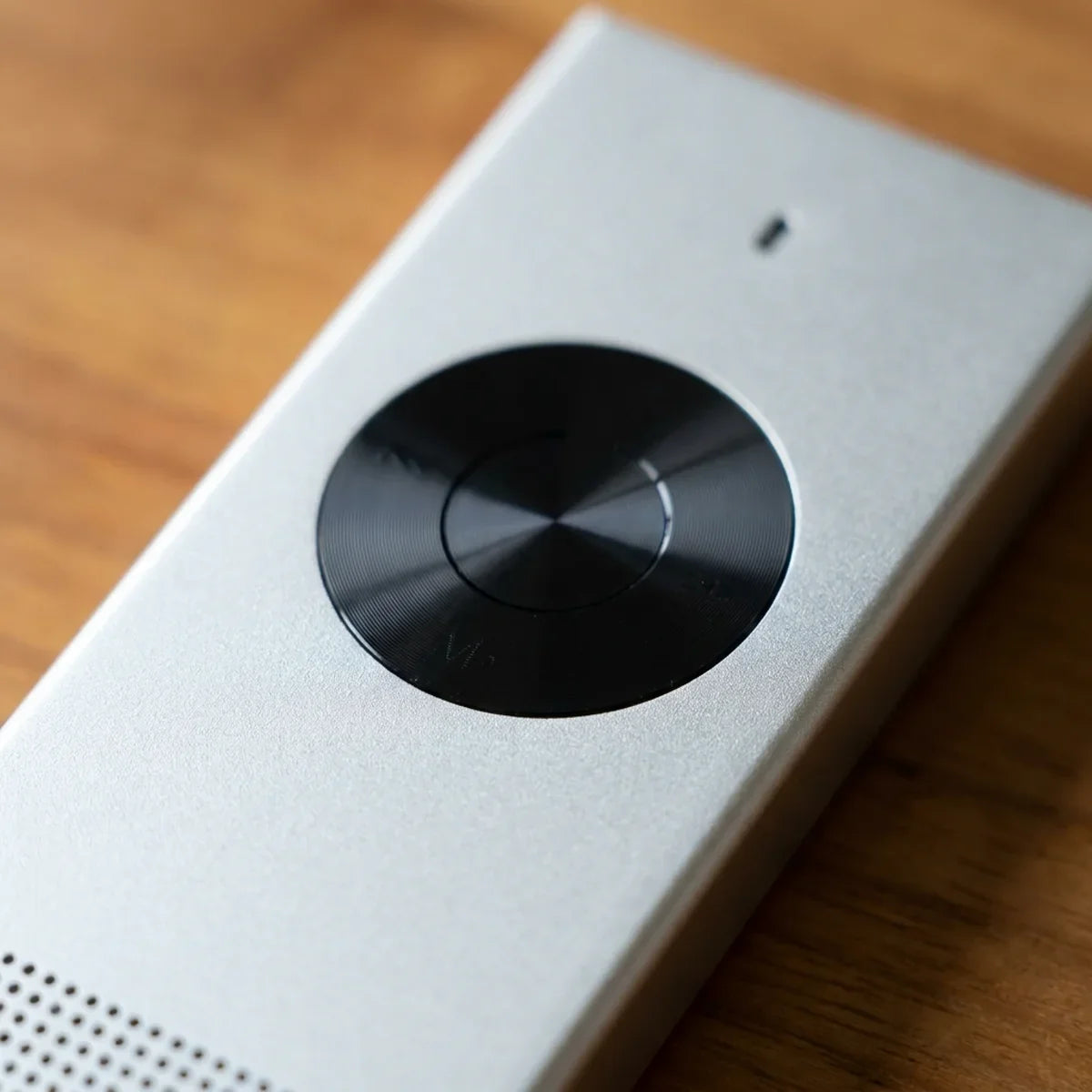 Close-up of the brushed metal and the button