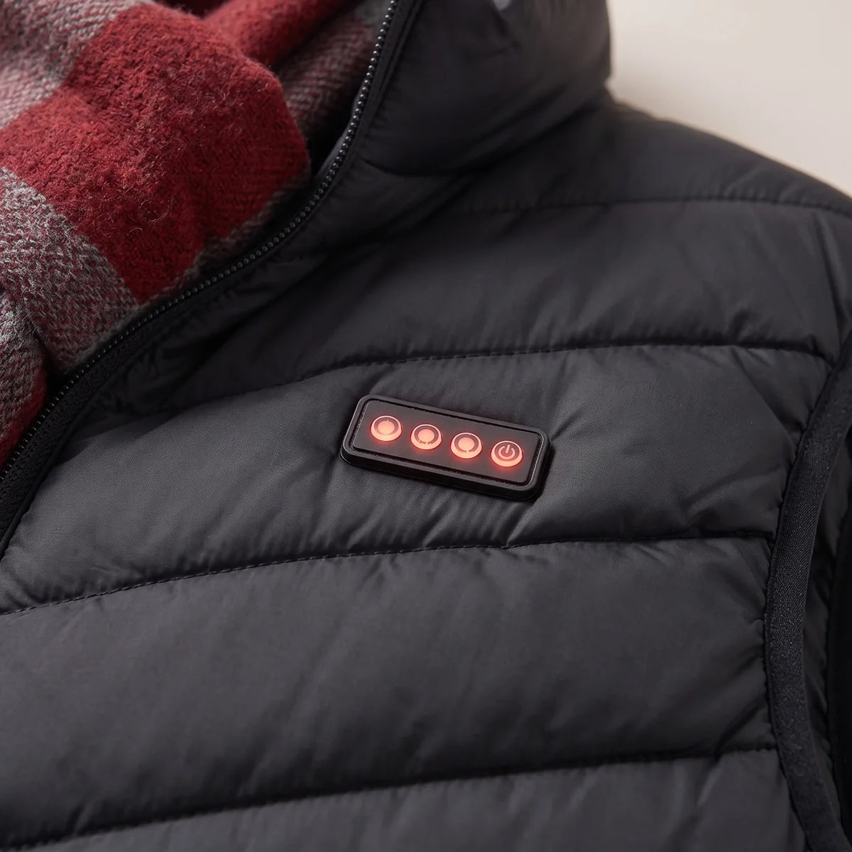 Close-up of the four buttons on the chest panel of the Calvane heated vest