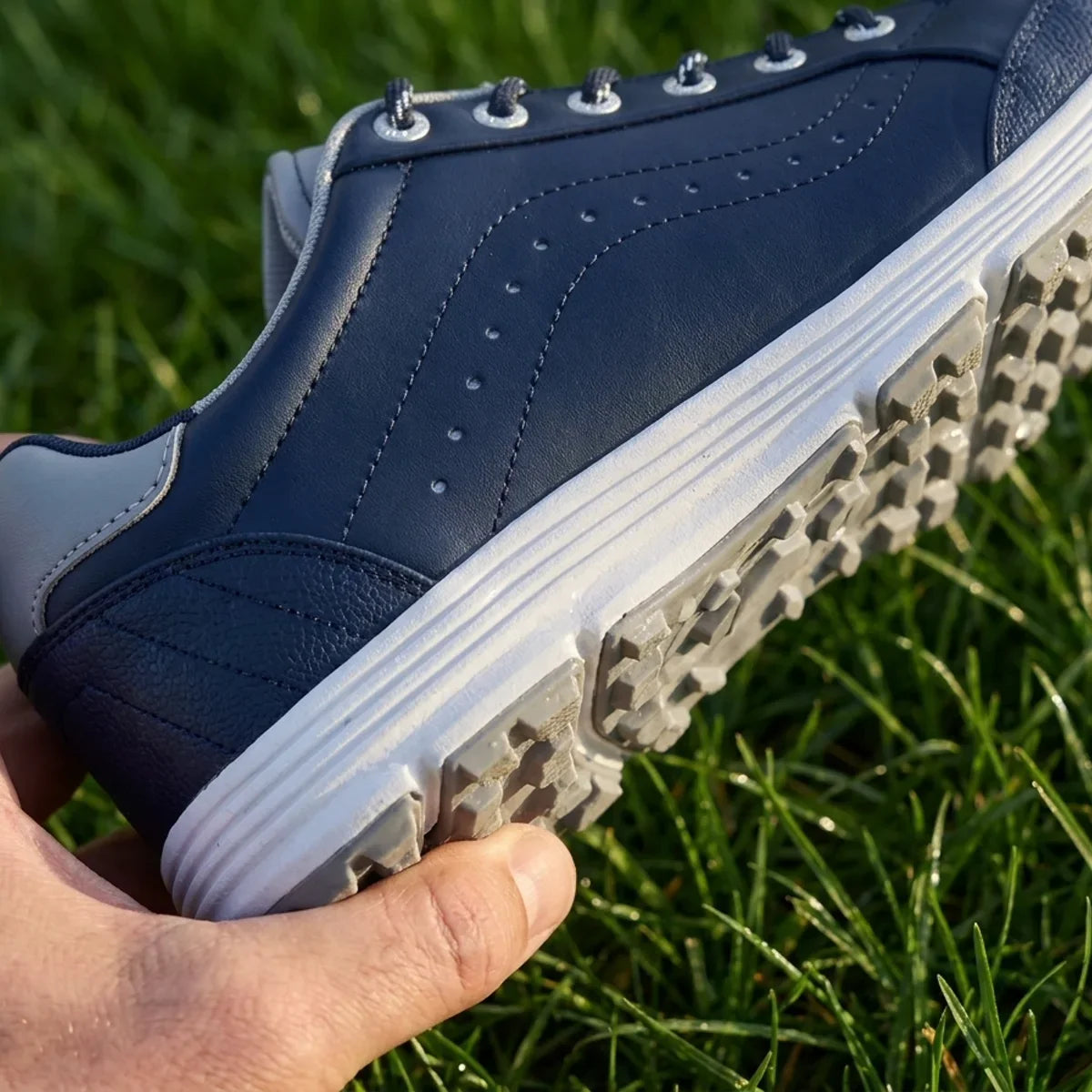 Close-up of the moulded outsole held in a hand