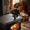 Gloved hand lifting the stove fan by its wire handle