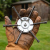 Thornwell steel wire head held in a gloved hand, about the size of a palm