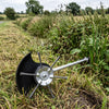 Ditch bank half cleared with the steel wire head, half still overgrown