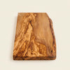 The Alba Live-Edge Olive Wood Slab alone on a plain background