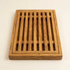 The Alba Olive Wood Bread Board with Crumb Tray alone on a plain background