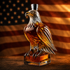 Eagle decanter filled with whiskey in front of the American flag